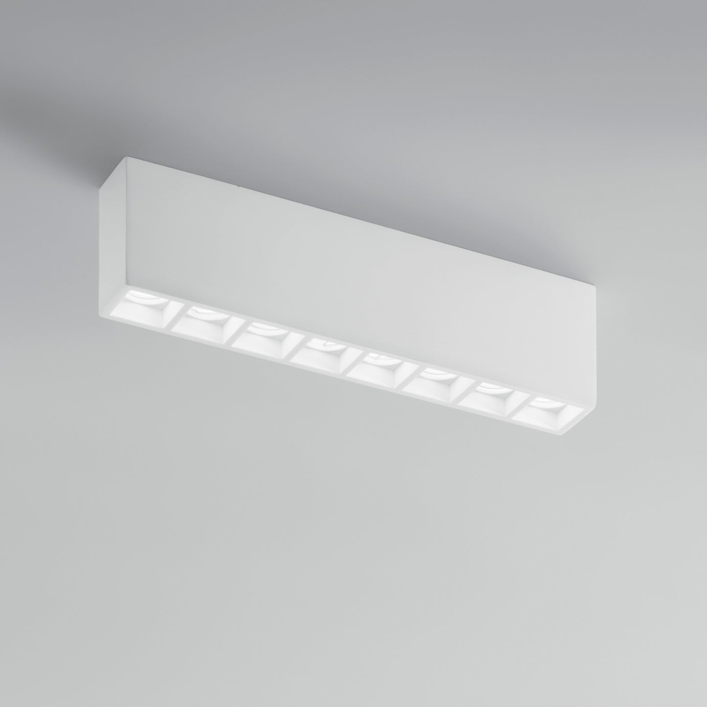 Plafoniera componibile HAPIS rettangolare in gesso bianco verniciabile 8 punti luce