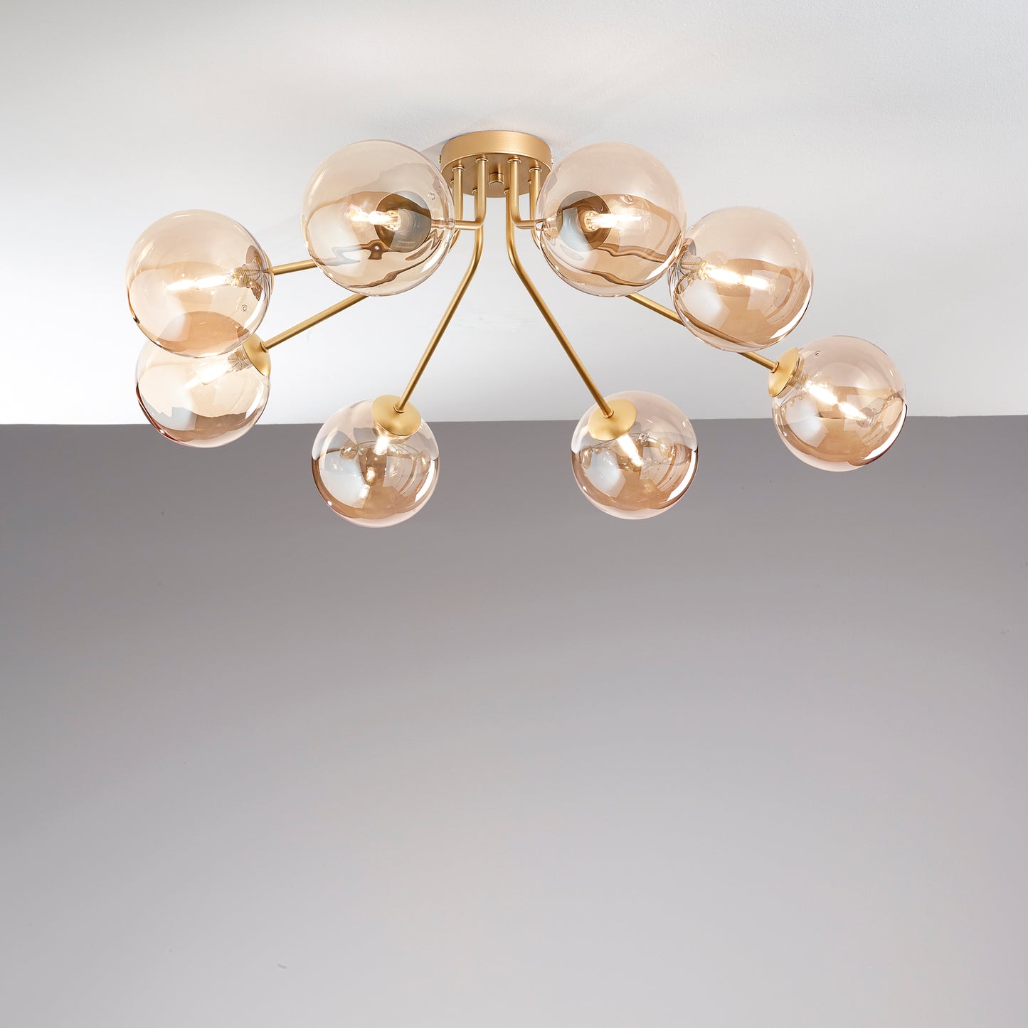 Plafoniera HONEY in metallo ottone con otto diffusori in vetro champagne