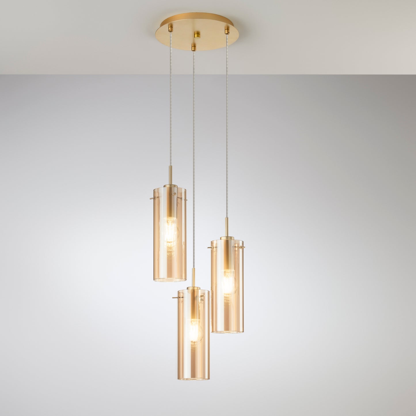 Sospensione MAGIC in metallo oro con 3 diffusori in vetro ambrato