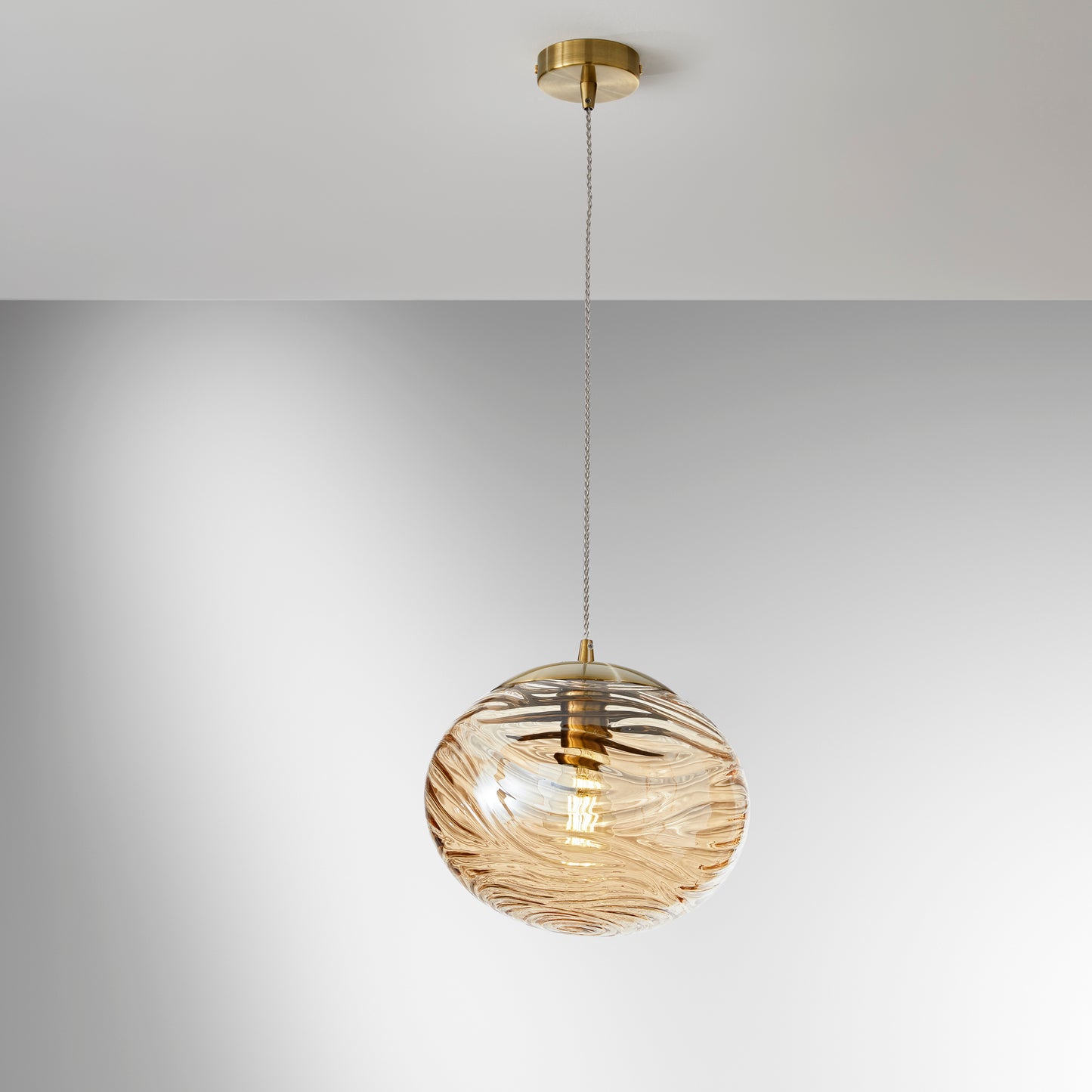 Sospensione NEREIDE 1 luce in vetro champagne ad onde concentriche