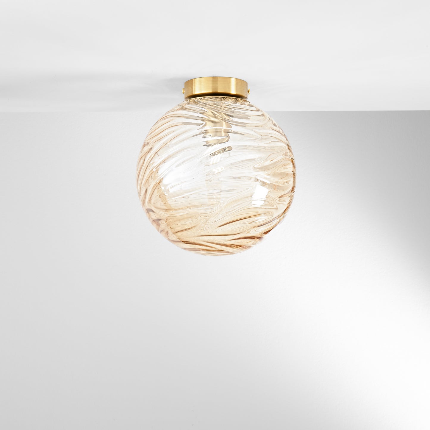 Plafoniera NEREIDE in vetro champagne ad onde concentriche Ø 25 cm.