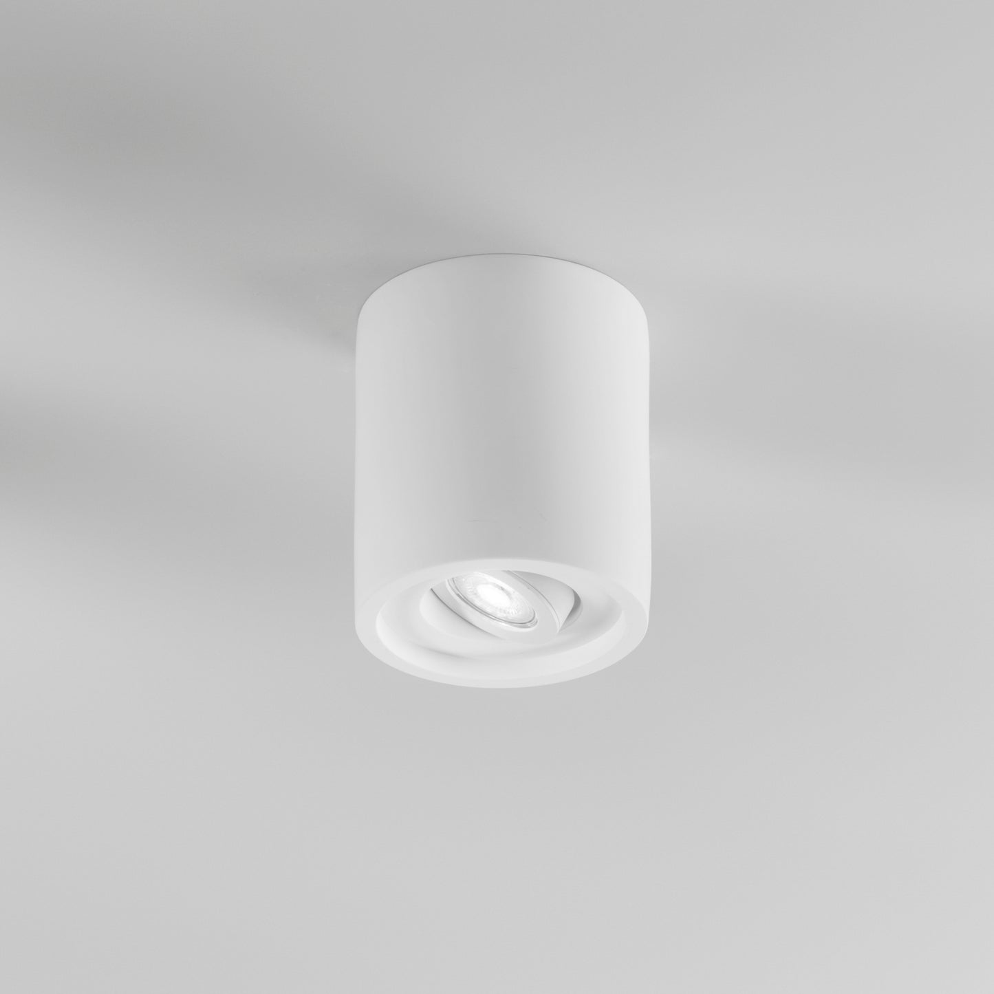 Plafoniera SPACE circolare in gesso verniciabile con ghiera orientabile Ø 13,4cm.