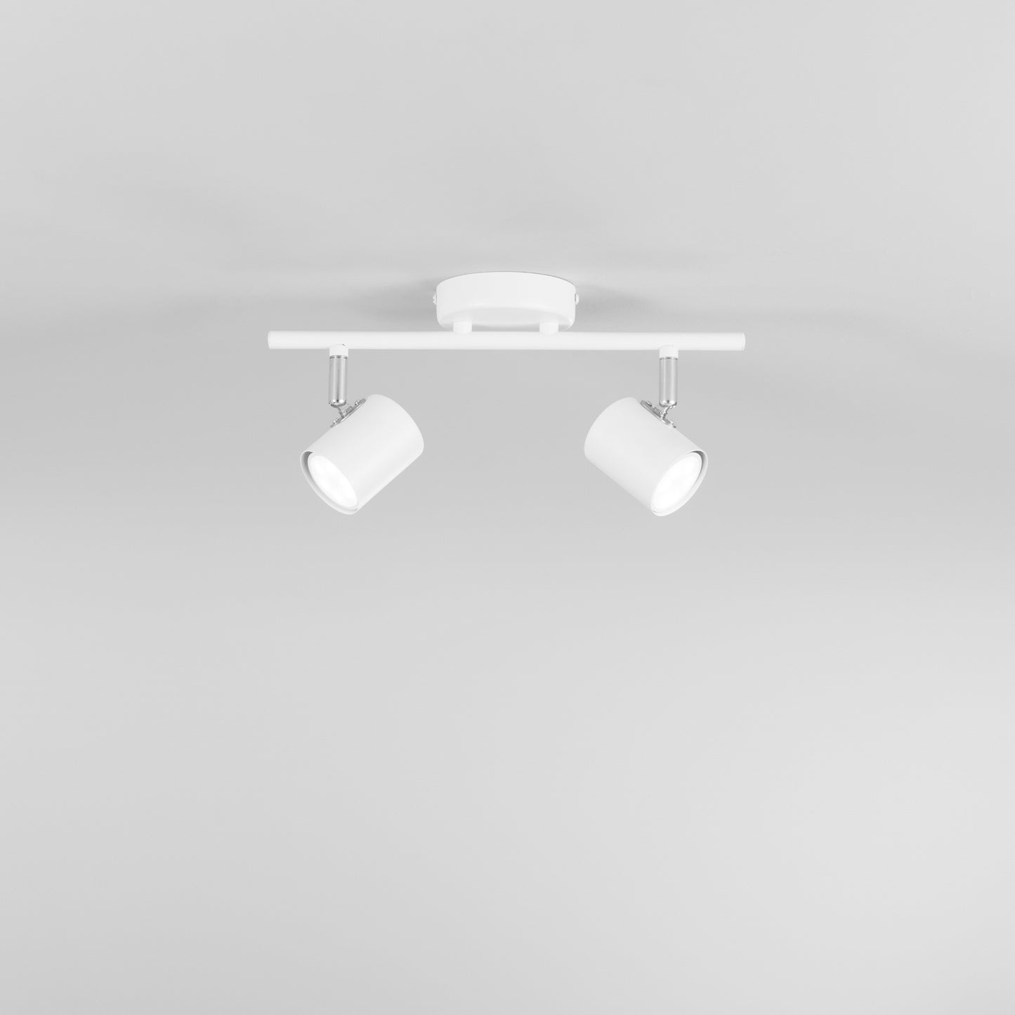 Spot ZERO in metallo bianco con 2 punti luce orientabili